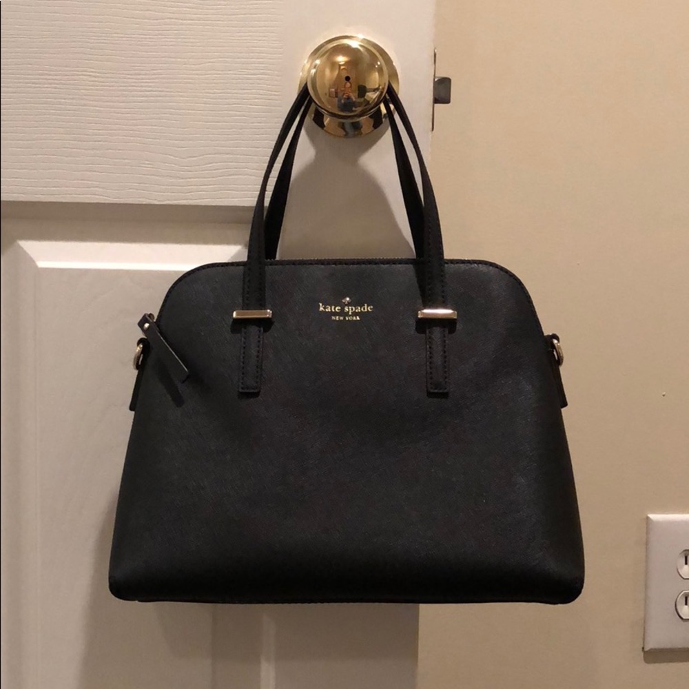 Black Kate spade purse with dust bag and arm strap